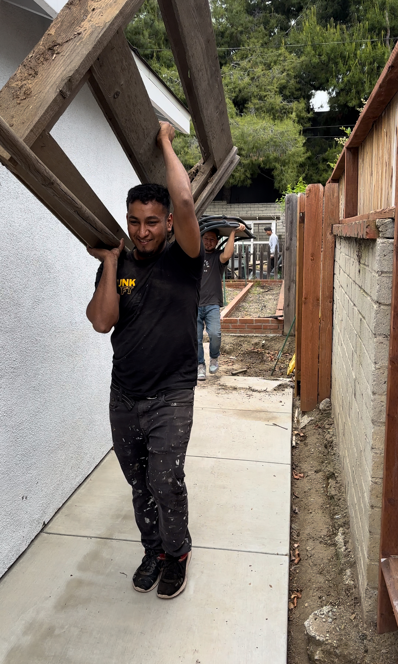 Residential demolition crew working safely at a suburban home