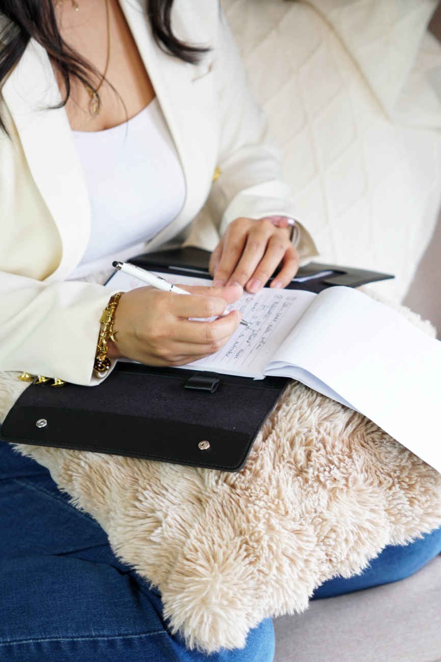 Annikka writing notes in a planner