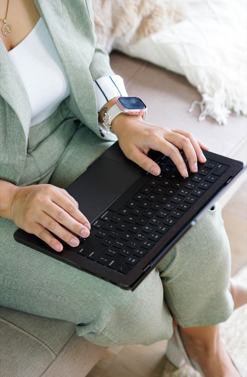 Annikka typing on her laptop