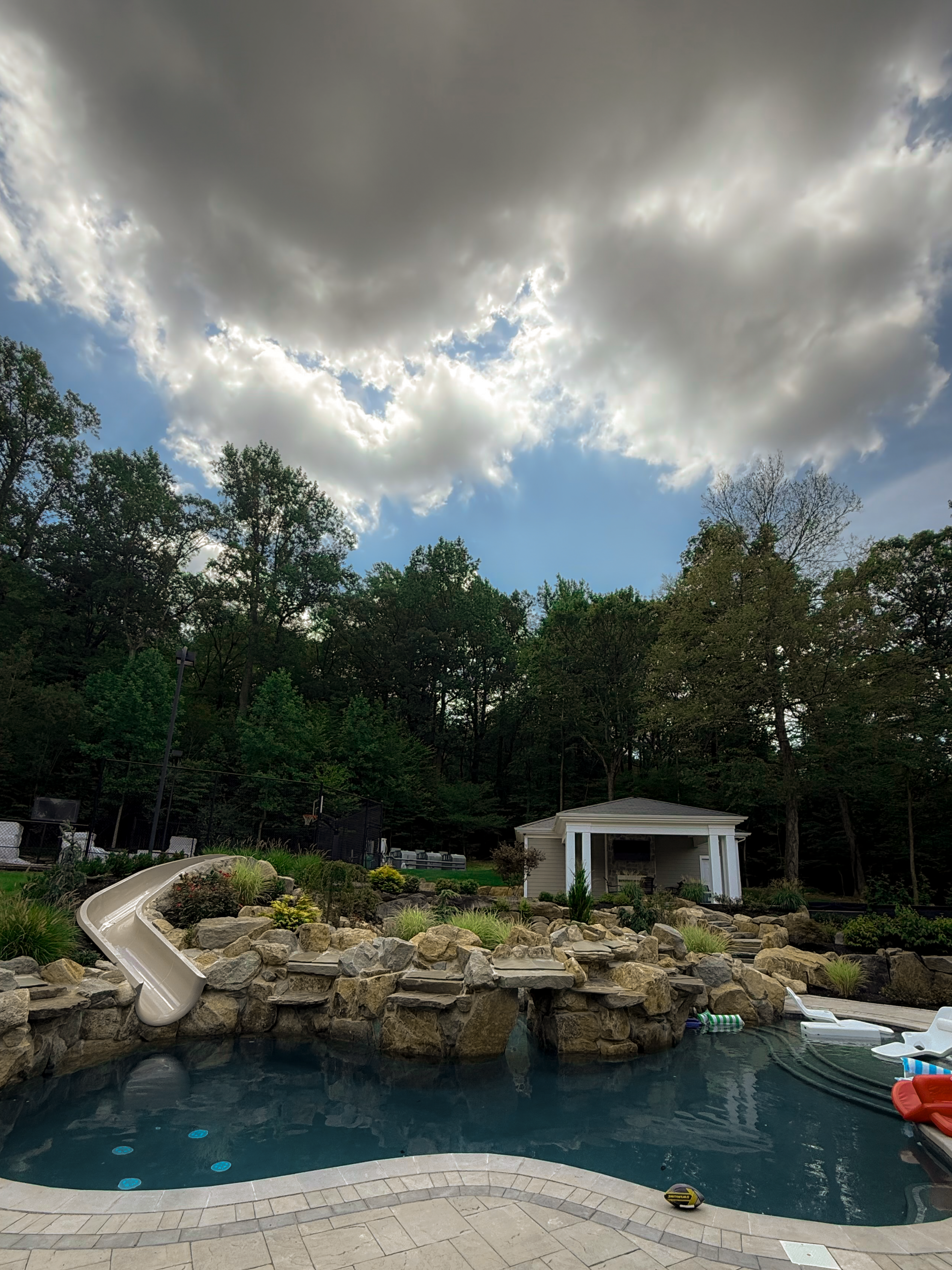 Natural stone waterfall and slide pool in NJ