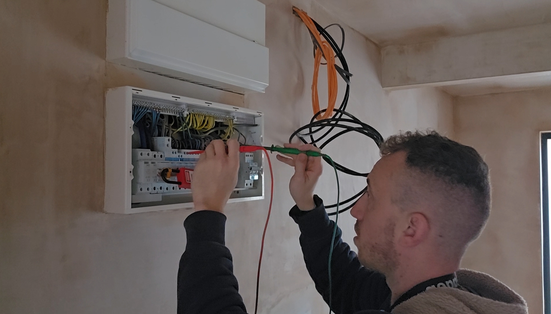 Electrician working on consumer unit — Clevedon Electric