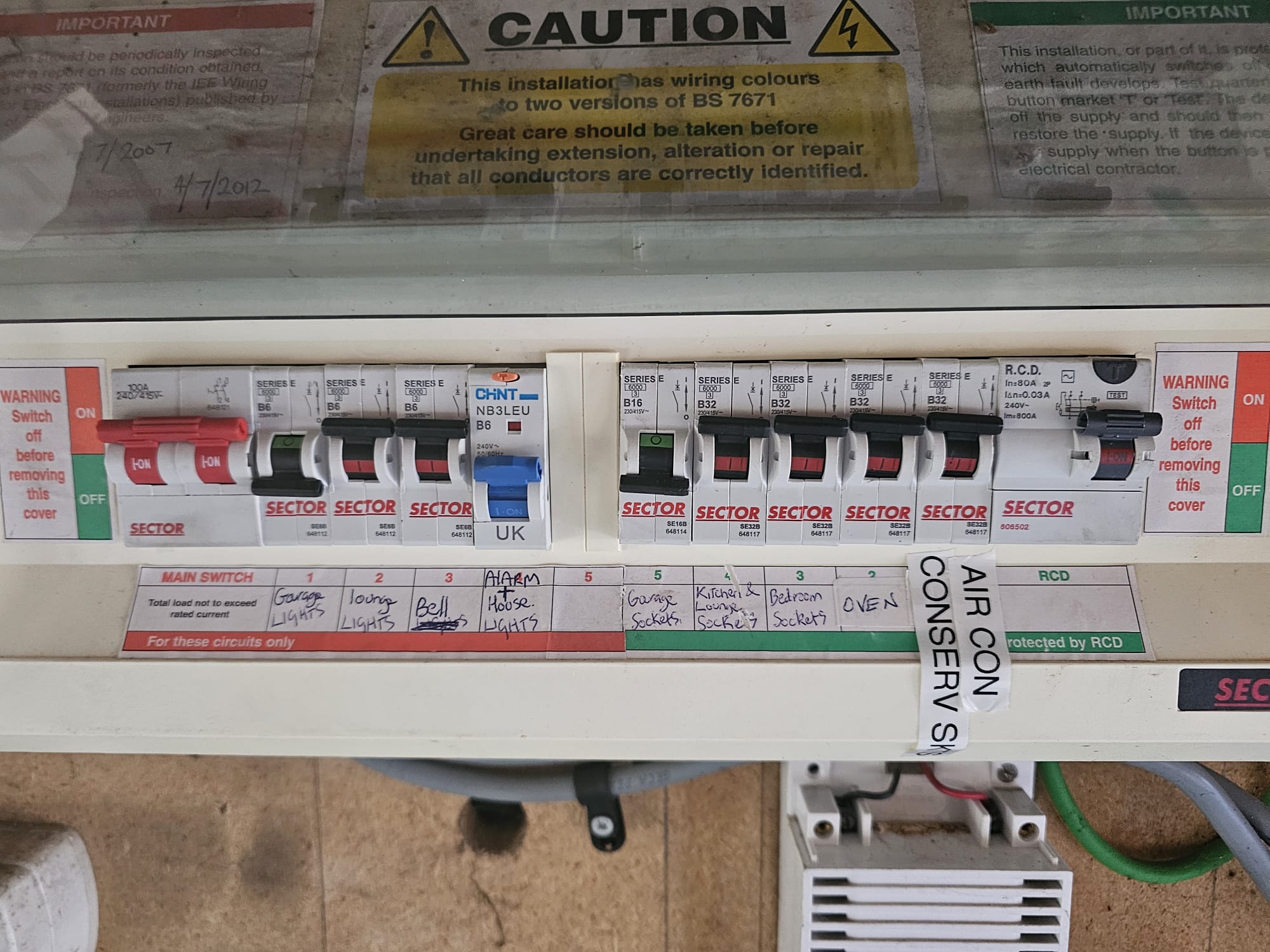 Old plastic consumer unit being replaced — North Somerset