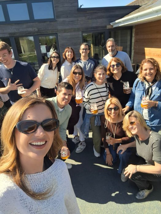 Savvy English group toasting drinks together during the Cotswolds immersion