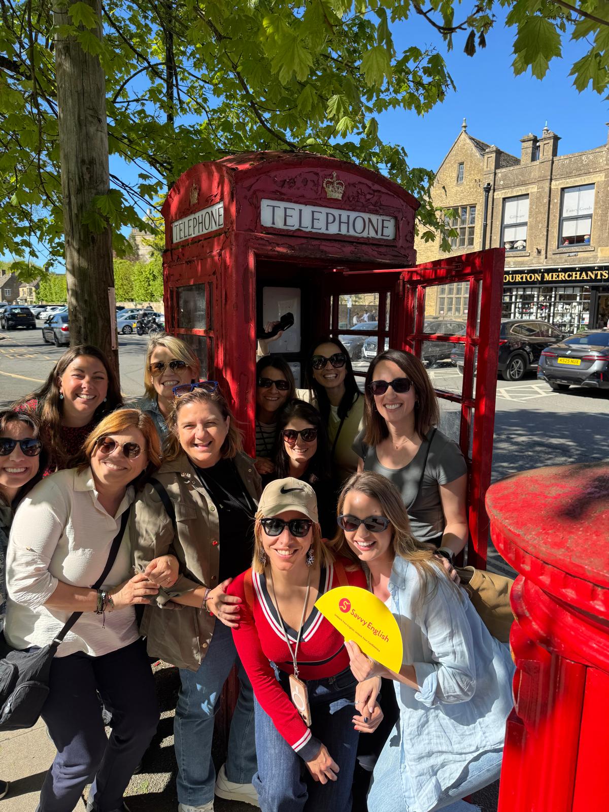 Savvy English group at a red telephone box during the Cotswolds immersion