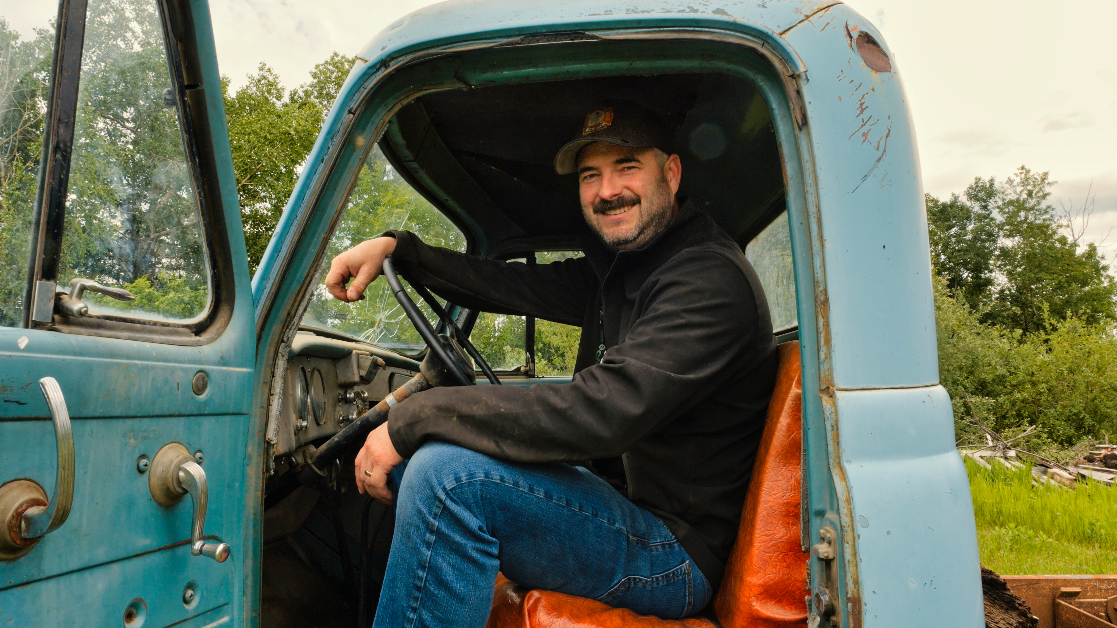 James McGonigal sitting in an old truck