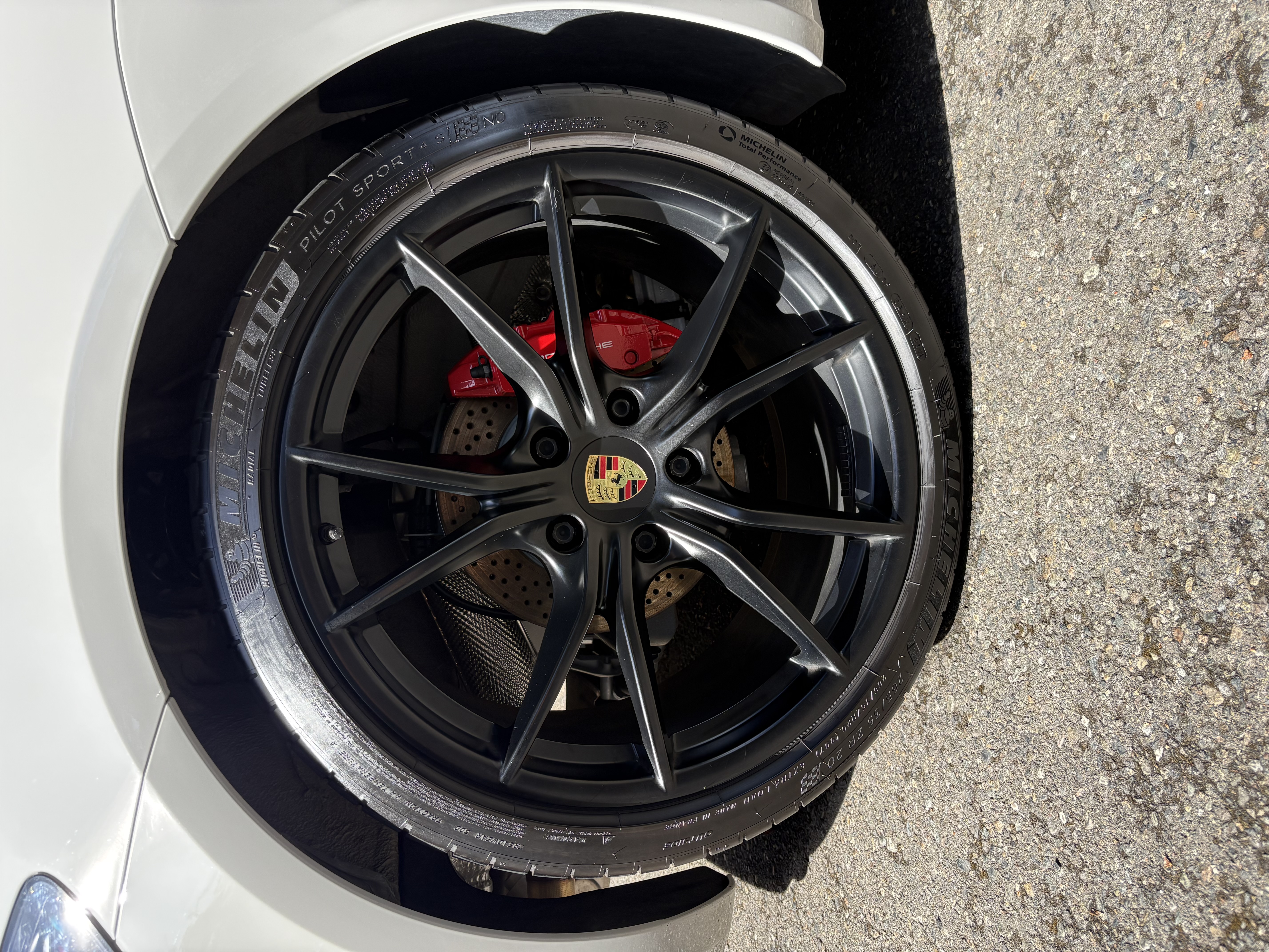 Porsche wheel detail close-up showing precision cleaning