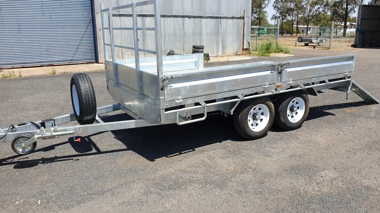 Galvanised tandem flat top trailer with headboard and loading ramps