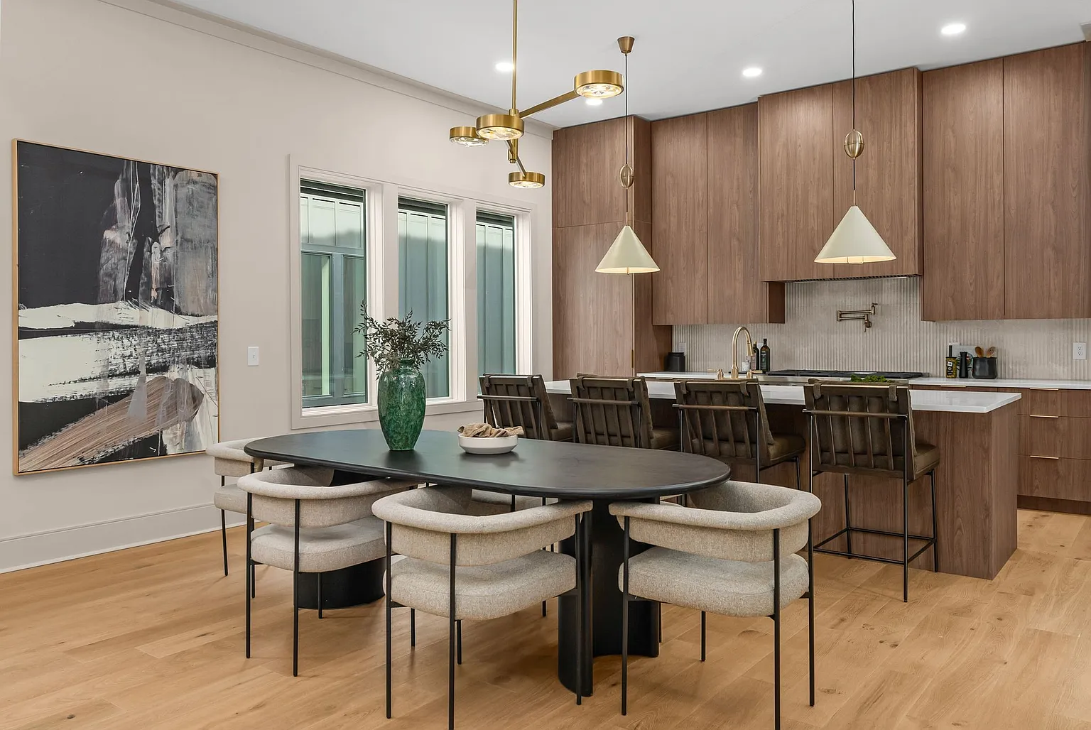Designer dining room and luxury kitchen with walnut cabinetry