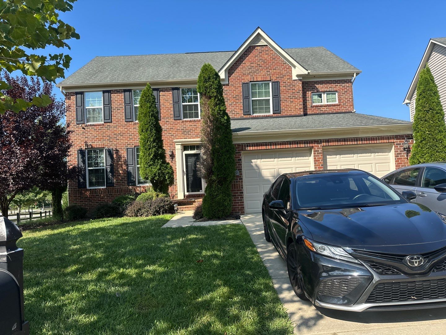 Completed residential roof replacement by Black Sun Restorations