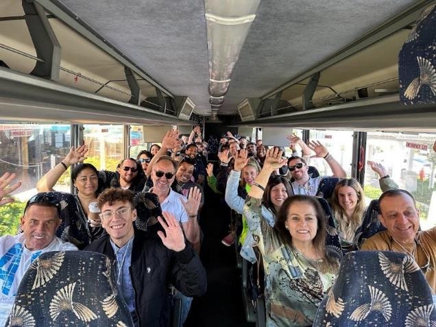 Lex Levinrad boot camp students on the property bus tour