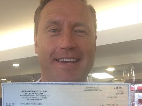 Erki holding his wholesale profit check