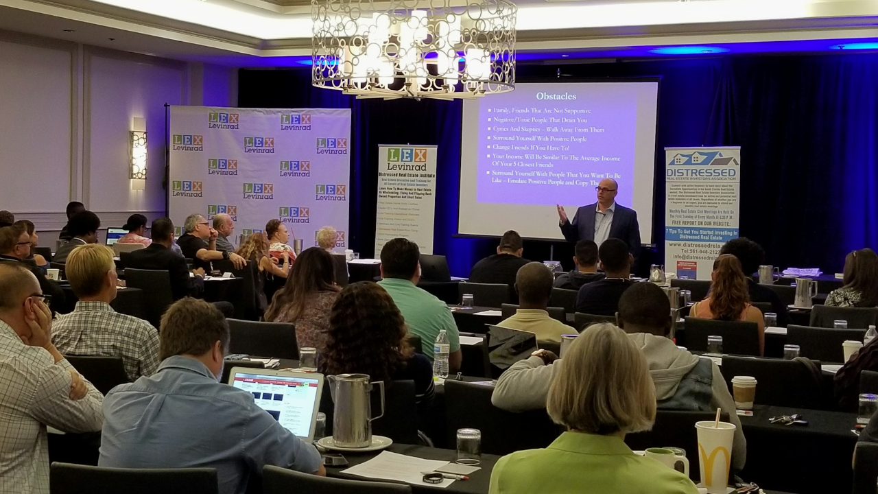 Lex Levinrad teaching a full room at the live boot camp