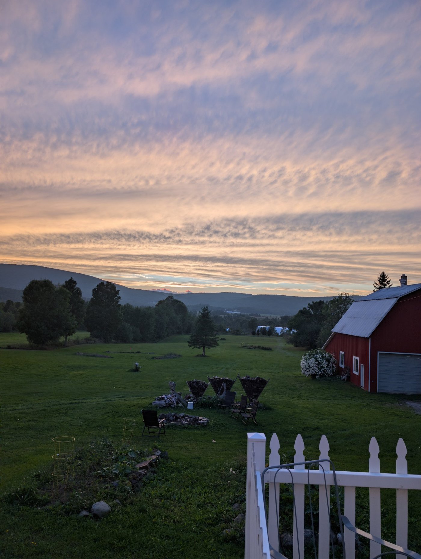 A quiet Vermont field at dusk, representing missed-call text-back keeping leads warm