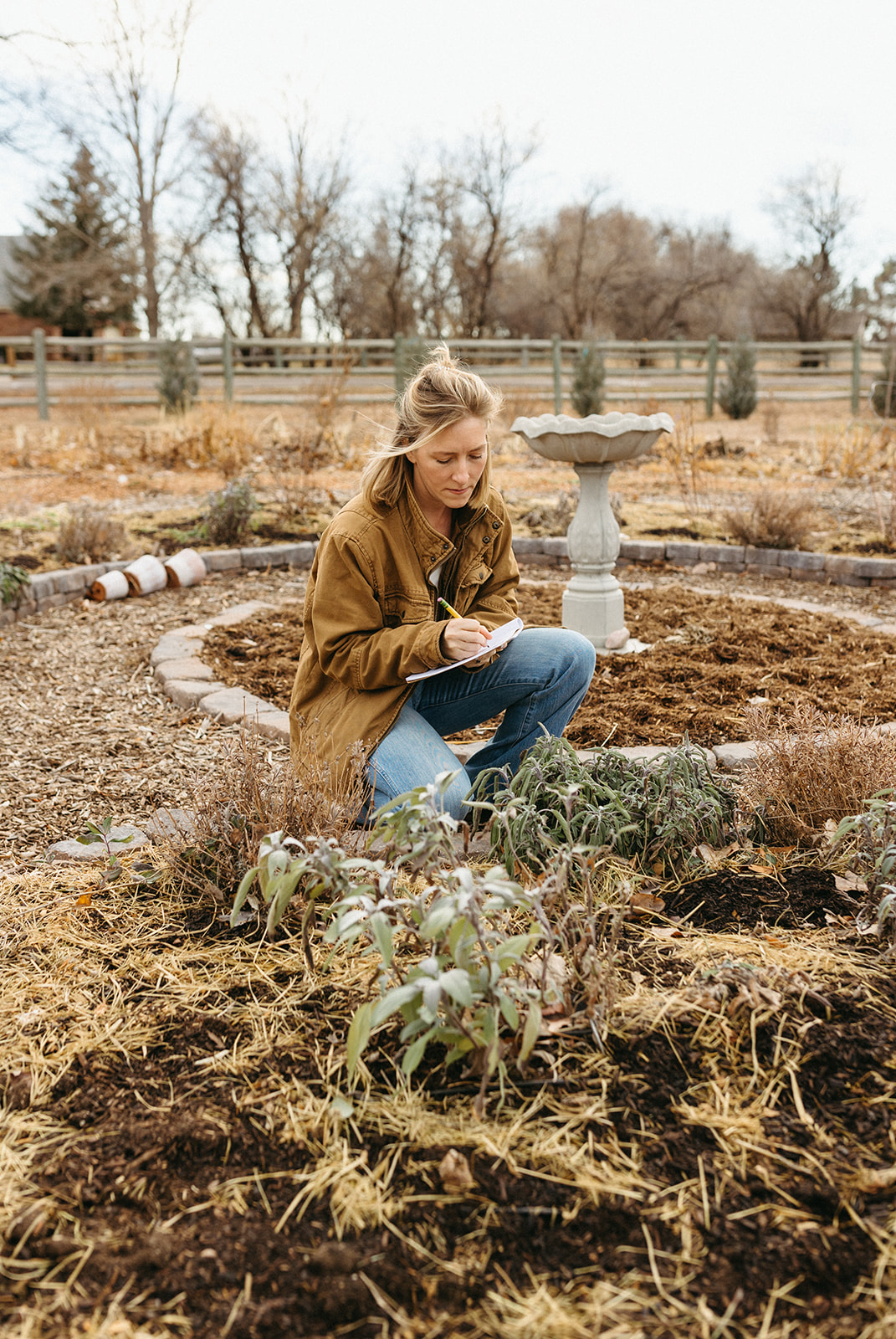 Cortney coaching a client in the garden
