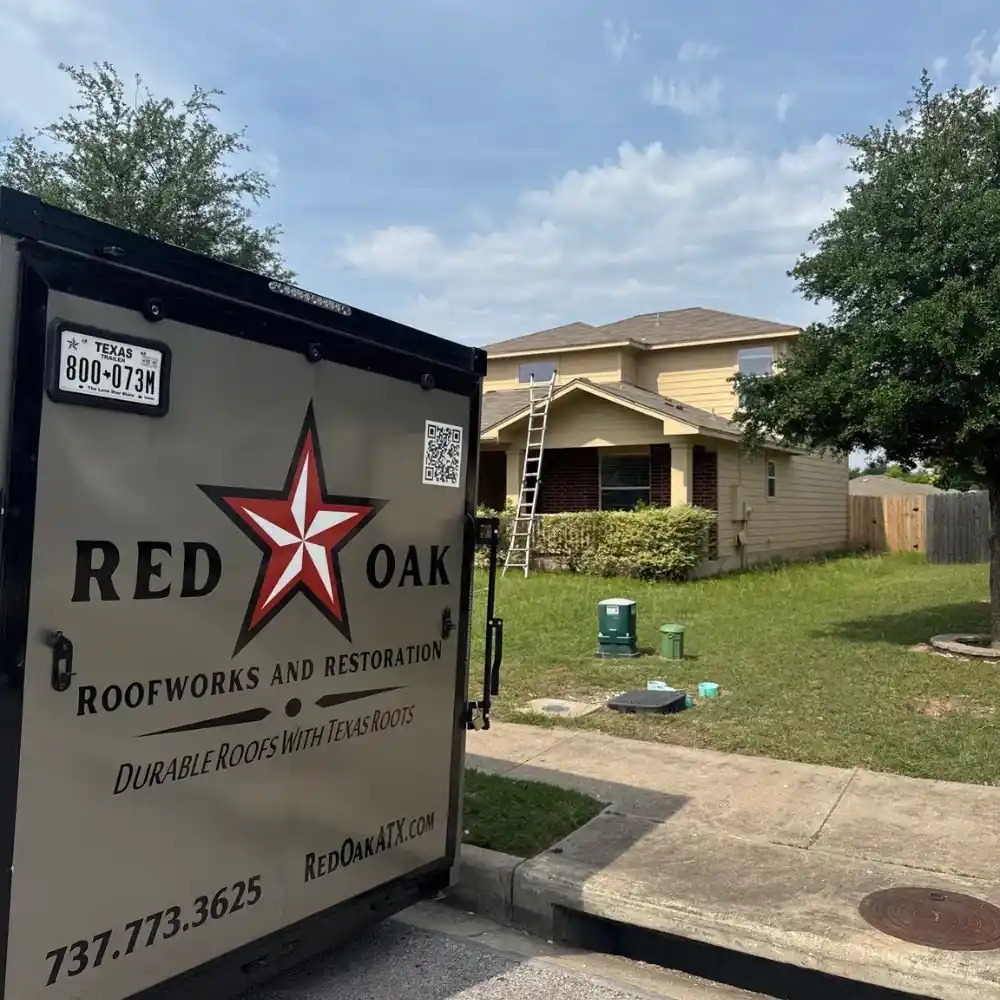 Red Oak Roofworks trailer at Round Rock home during roofing and restoration service