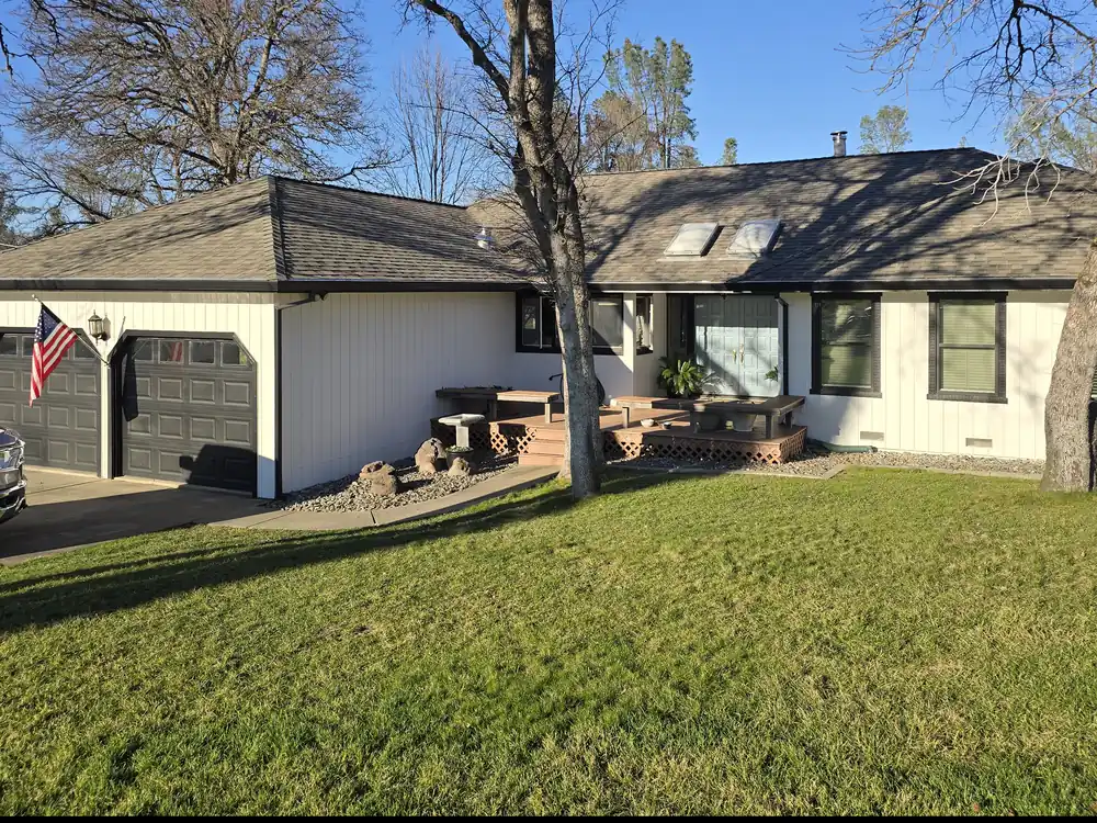 Finished home with new board and batten siding, deck and trim.