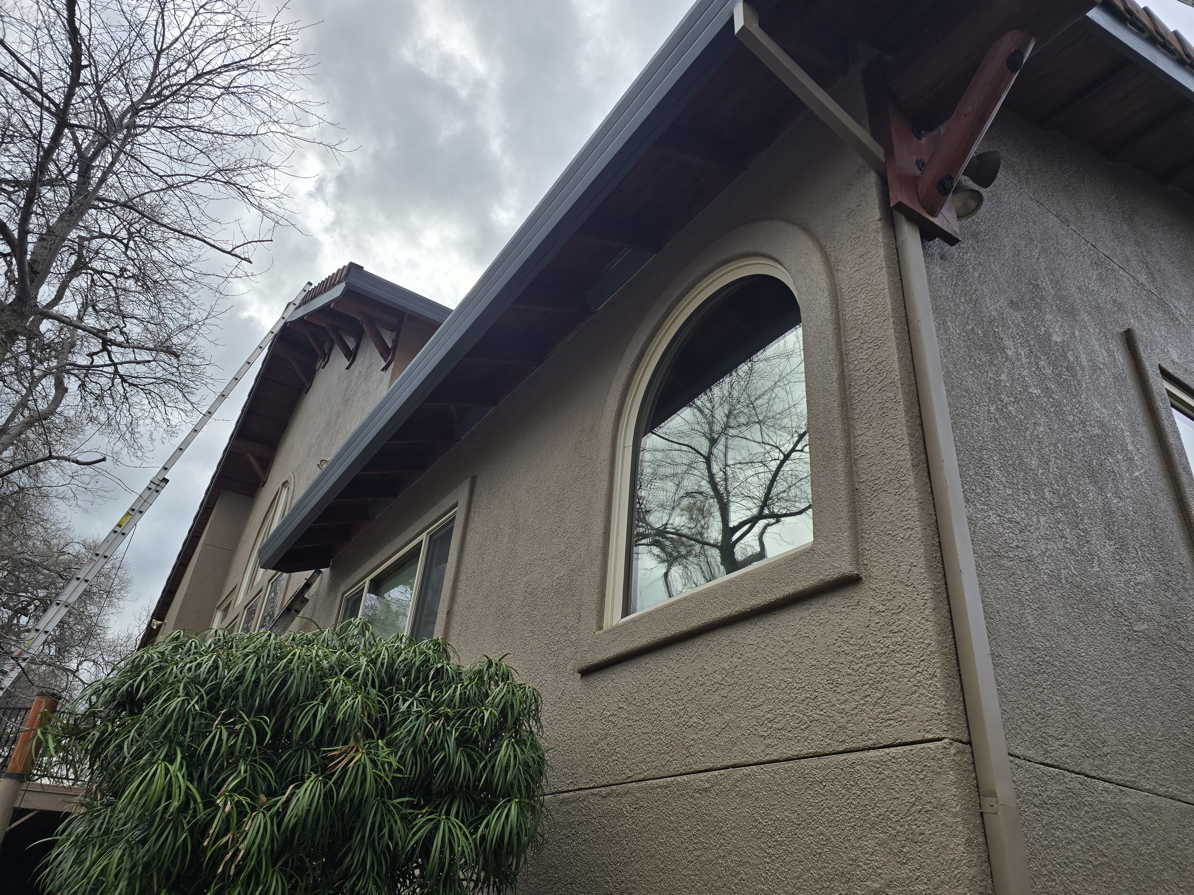 O’Brien exterior work: new fascia and gutter line along the roof edge.