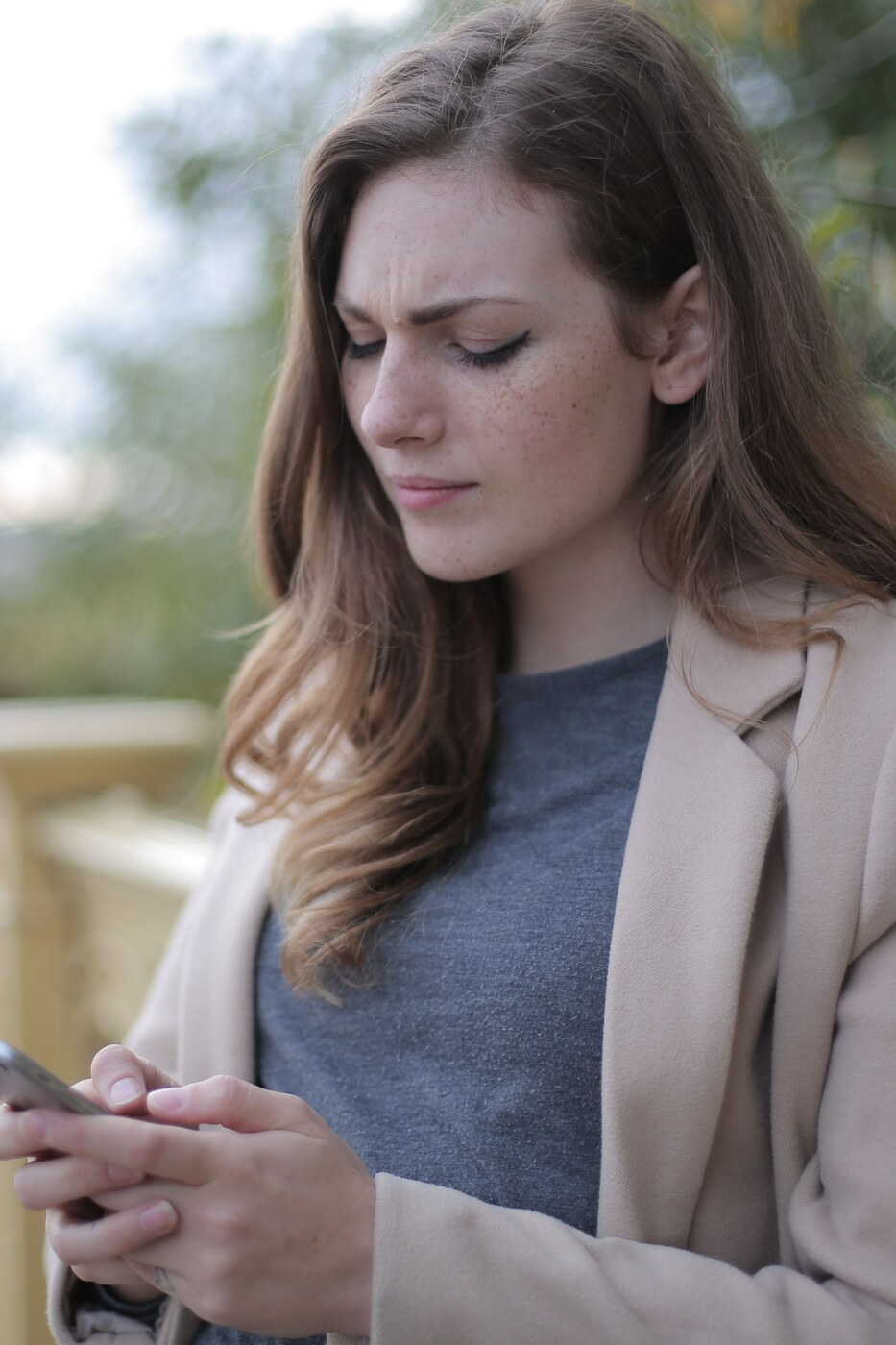Woman looking uncertain, searching for a beauty studio she can trust in a new area