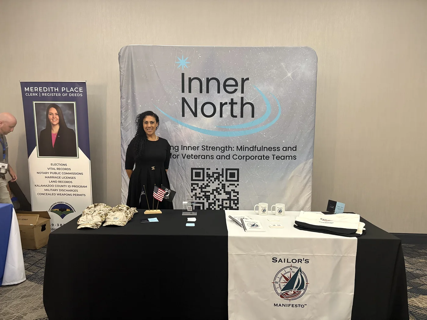 Suhey Fisher at her Inner North booth, with the Sailor&rsquo;s Manifesto table cover in front of her
