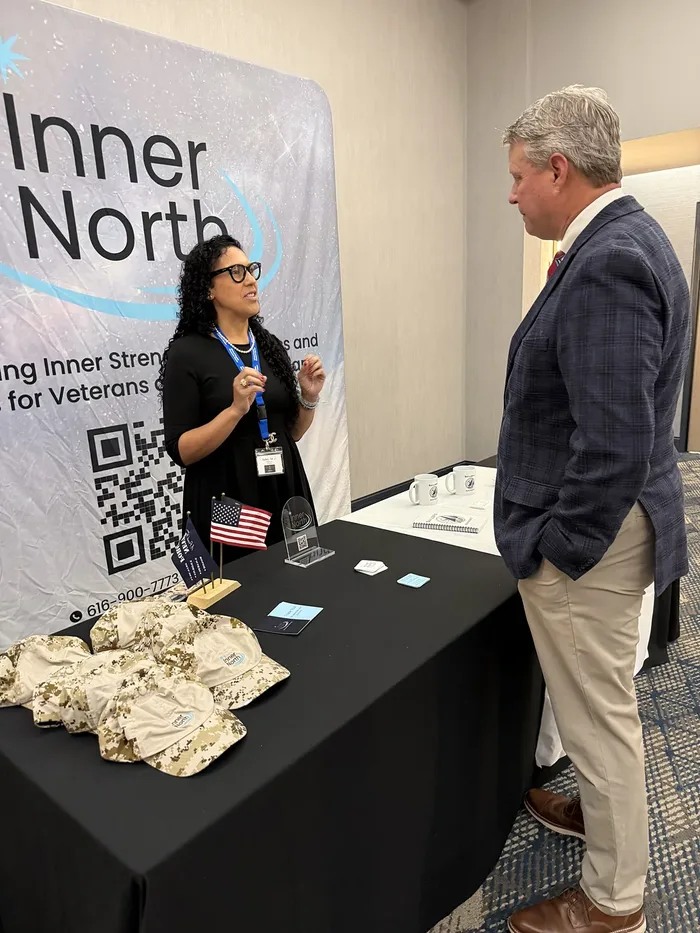 Suhey with Congressman Bill Huizenga at the Inner North booth