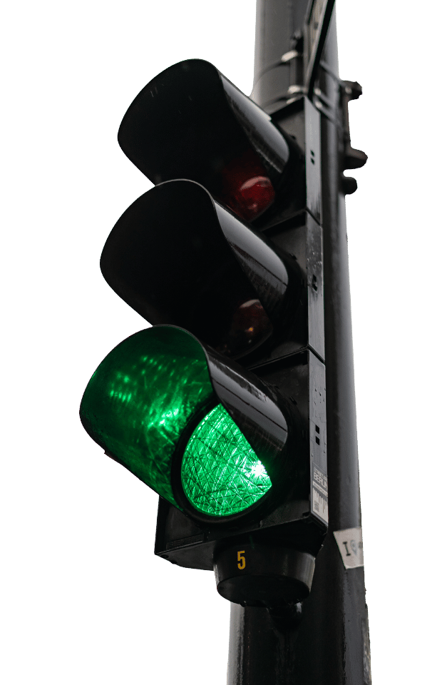 A green stoplight on a silver backround