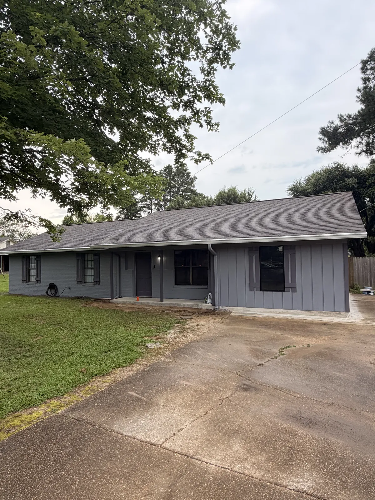 Front view of the finished single-story home with its new addition