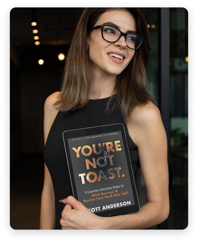 Photo of a woman holding a copy of You're Not Toast