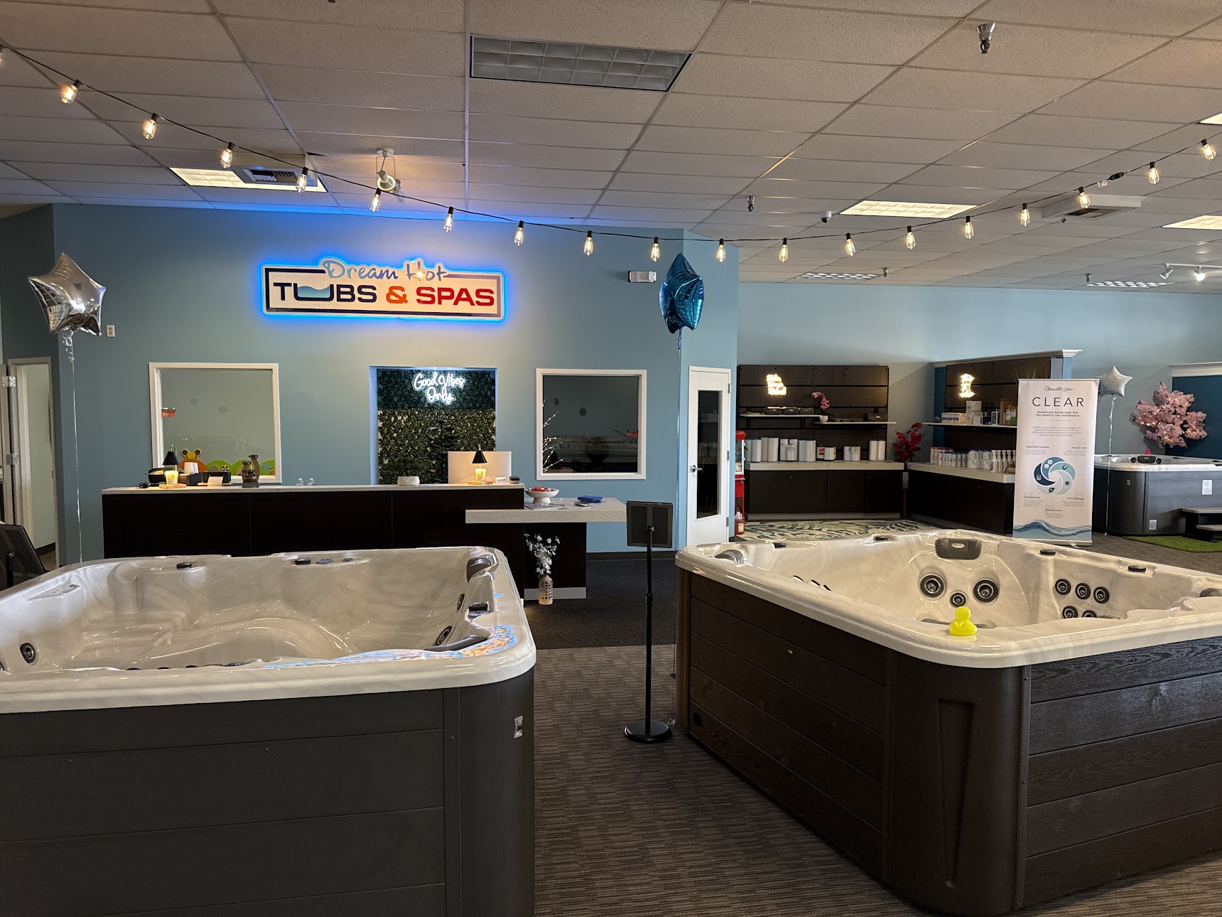 Bright showroom floor at Dream Hot Tubs & Spas in Mount Vernon, Washington featuring new hot tubs on display