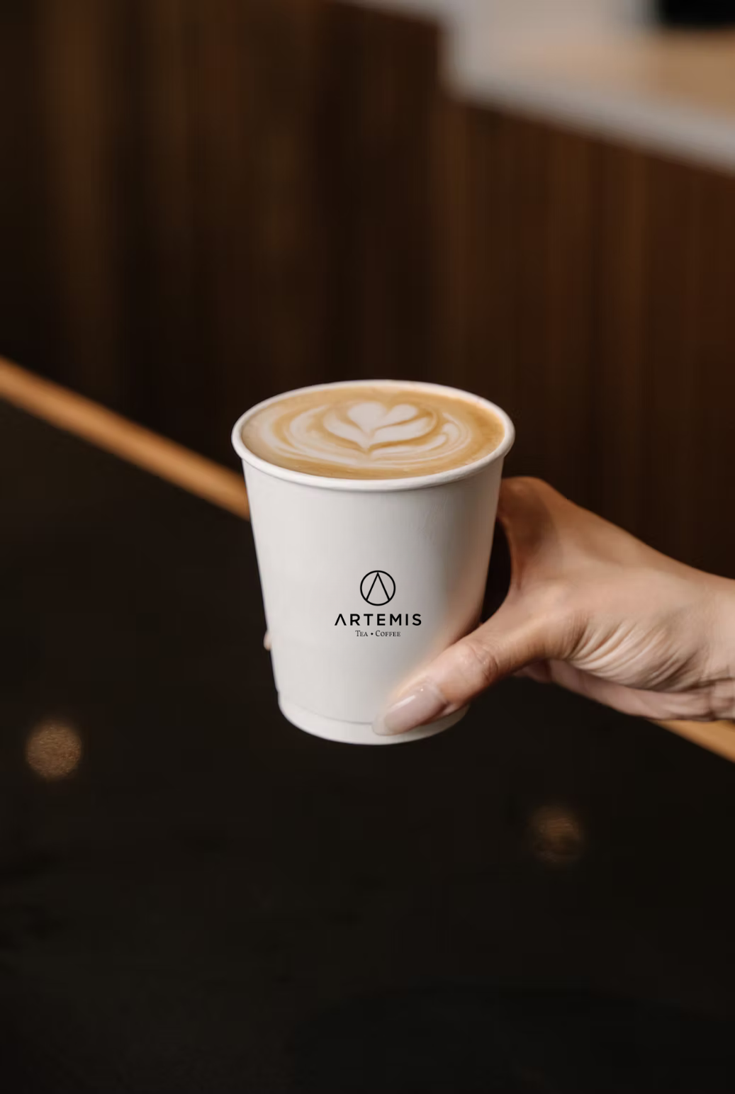 A cup of brown sugar milk tea with boba from Artemis Tea Coffee.