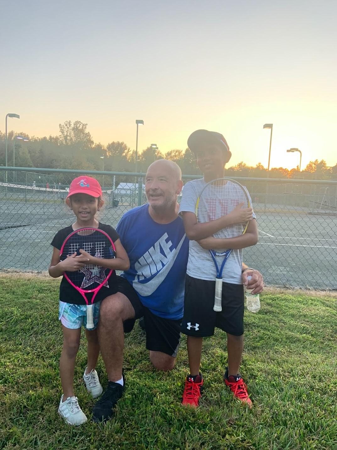 Young children learning tennis fundamentals at Heroes Tennis Academy's Tiny Aces program