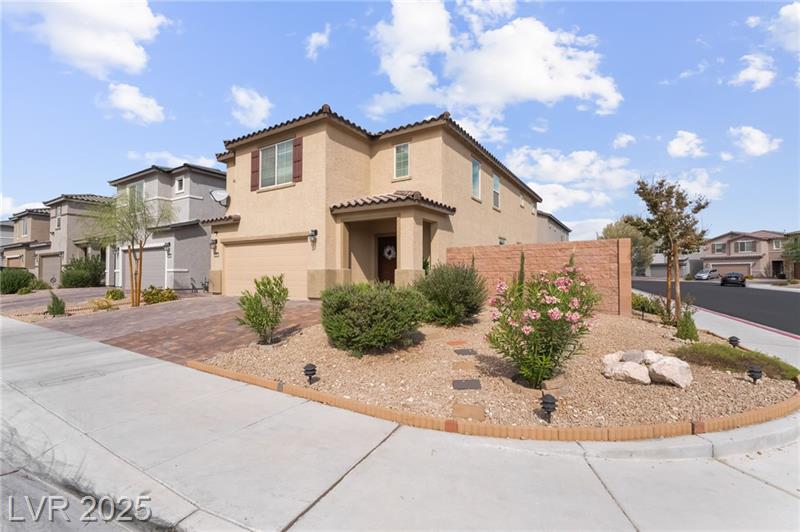 Beautiful upgraded contemporary home in northwest Las Vegas with lush landscaping and spacious interior.