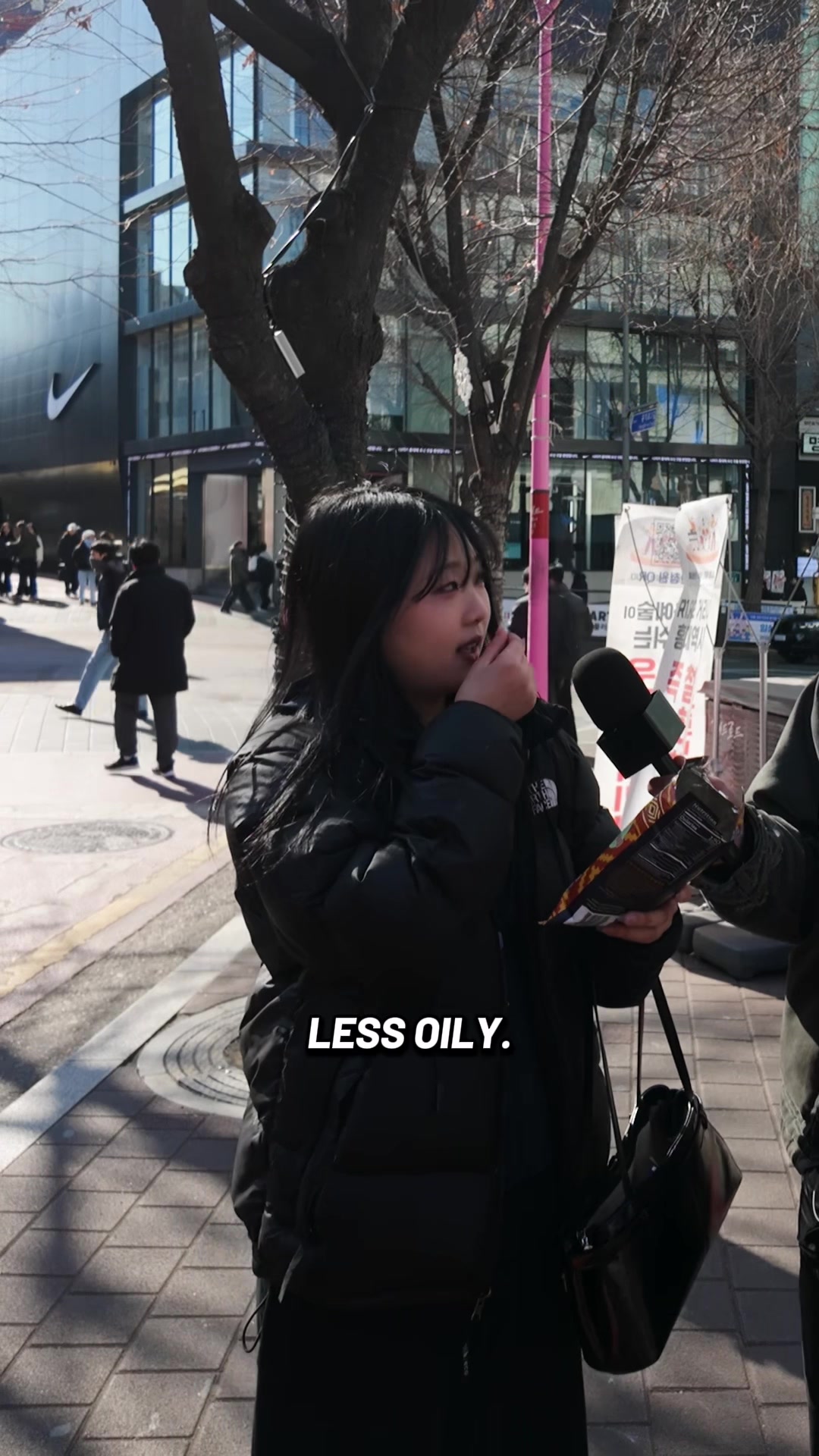 Street interview in Seoul, host holding an American snack product