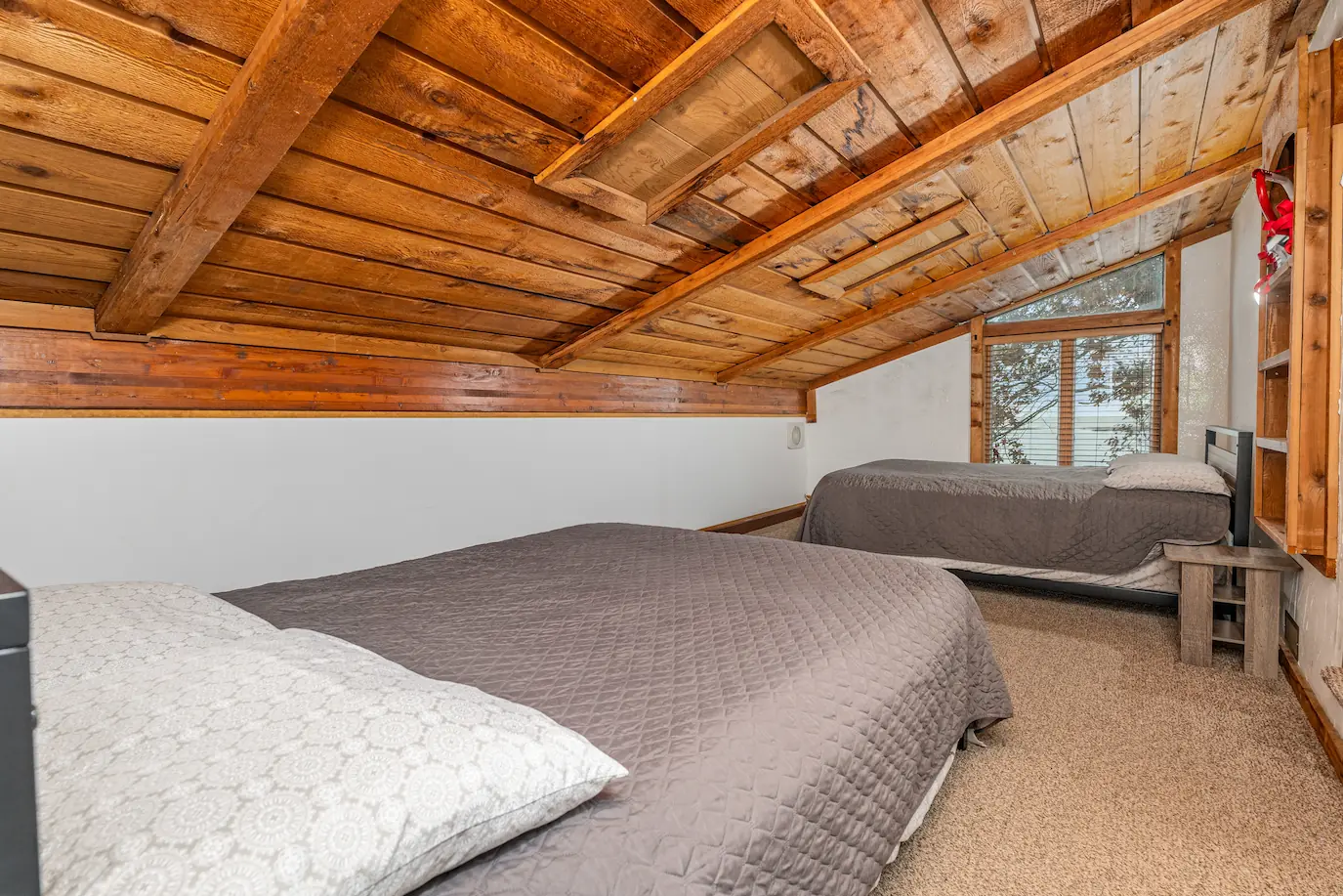 Cozy master bedroom retreat with natural light