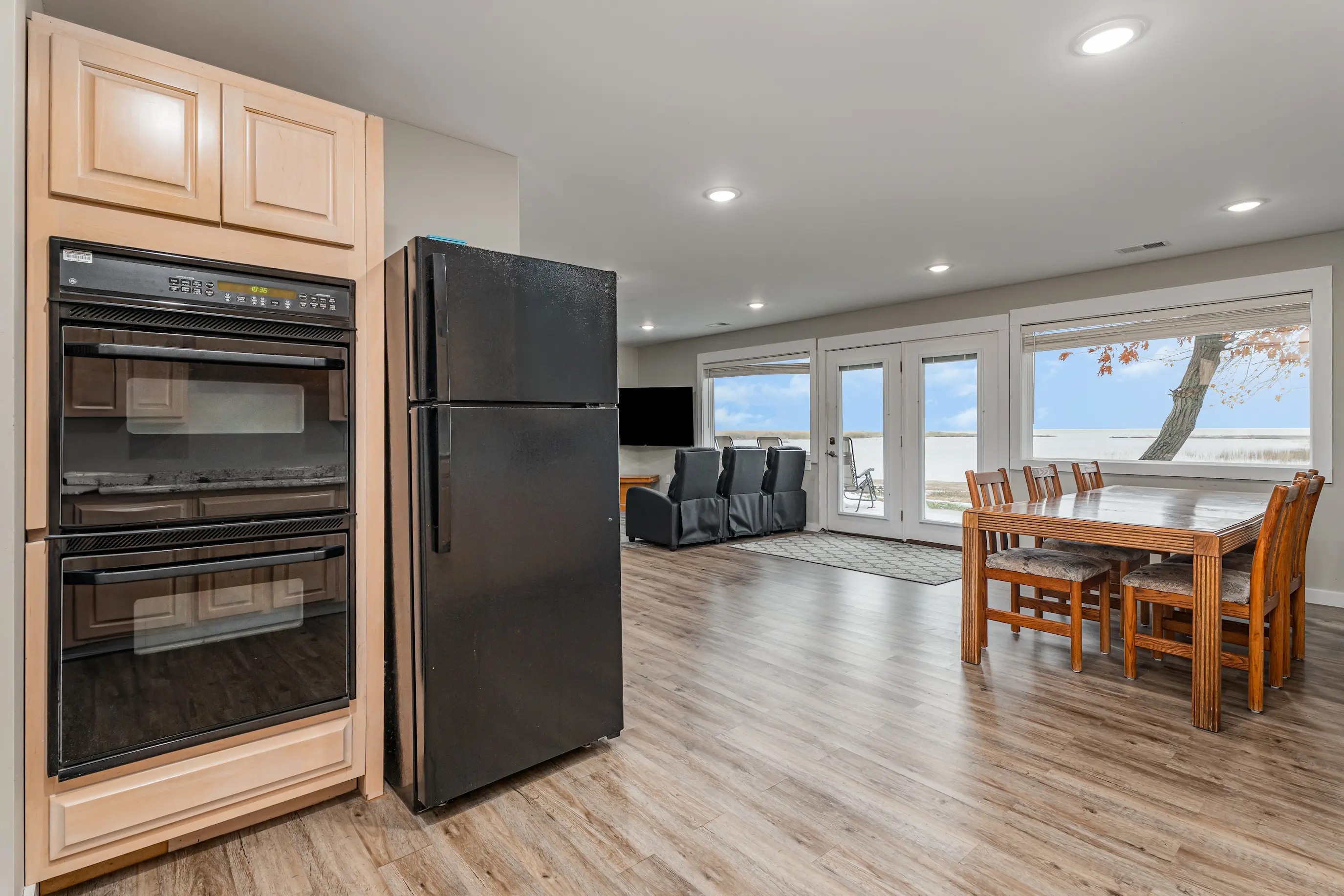 Open concept dining area and kitchen with beautiful lake views