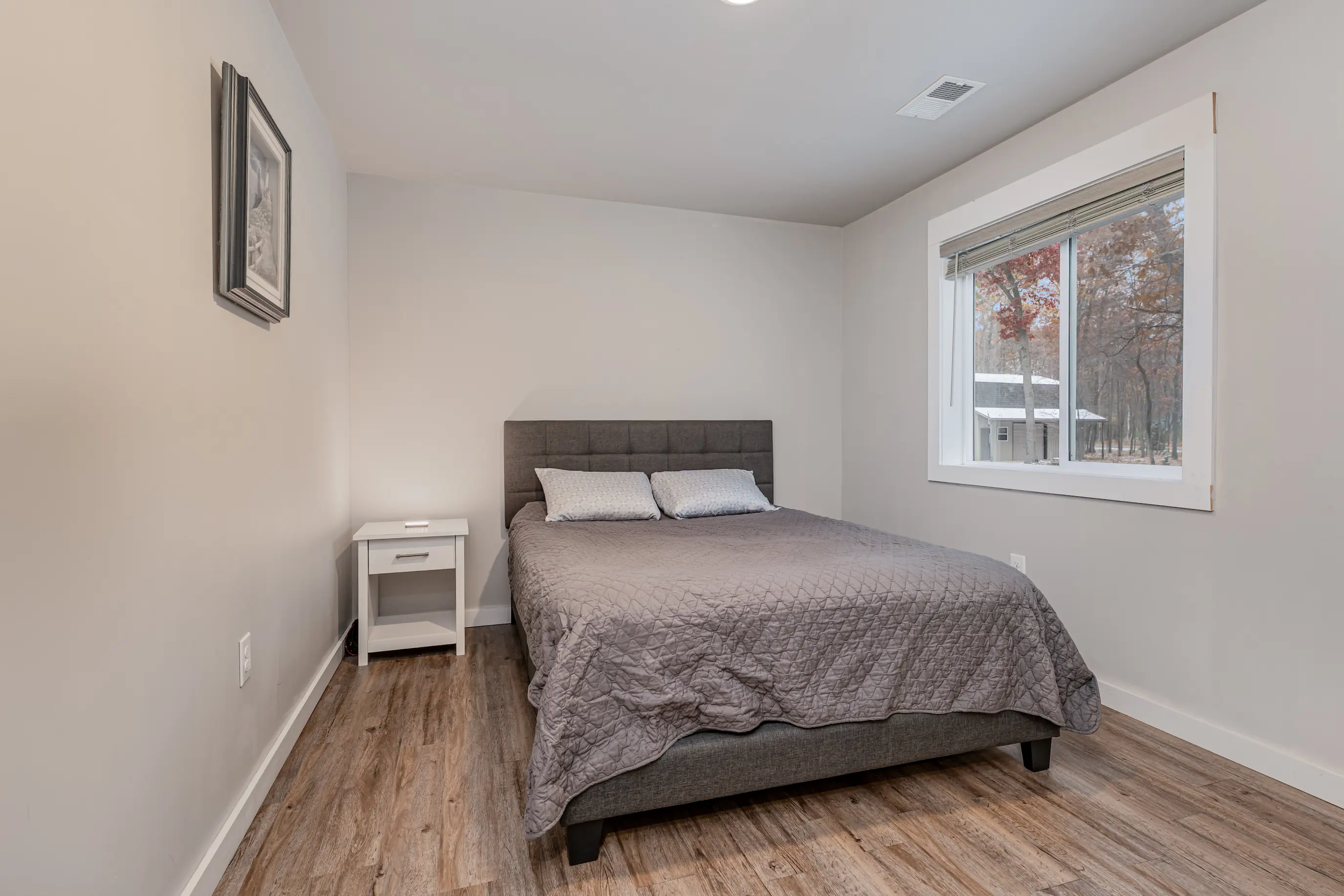 Inviting second bedroom with natural light