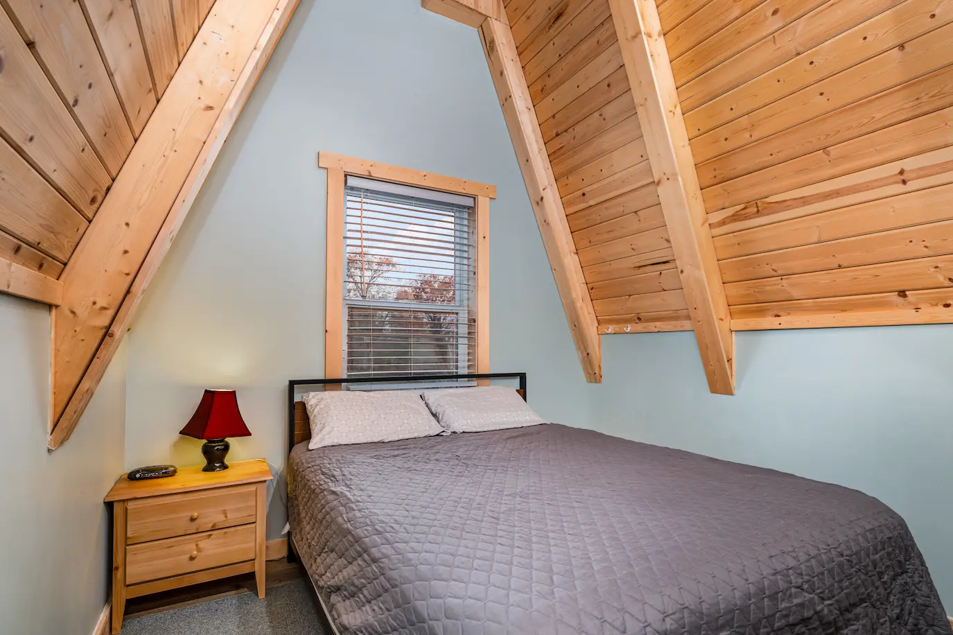 Cozy first-floor bedroom retreat at the A-Frame cabin