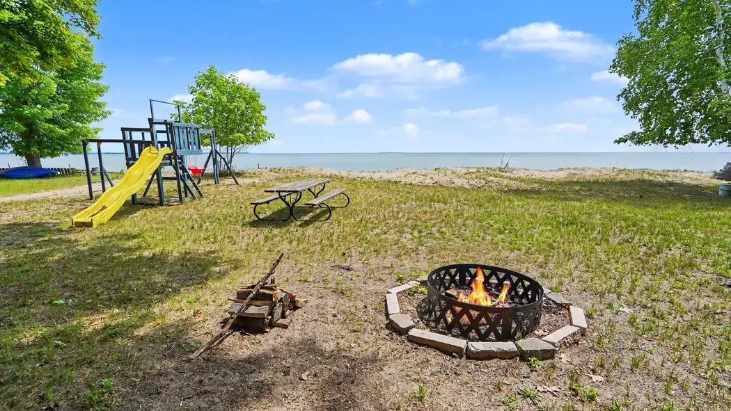 Backyard fire pit and playset at Granny's Cabin