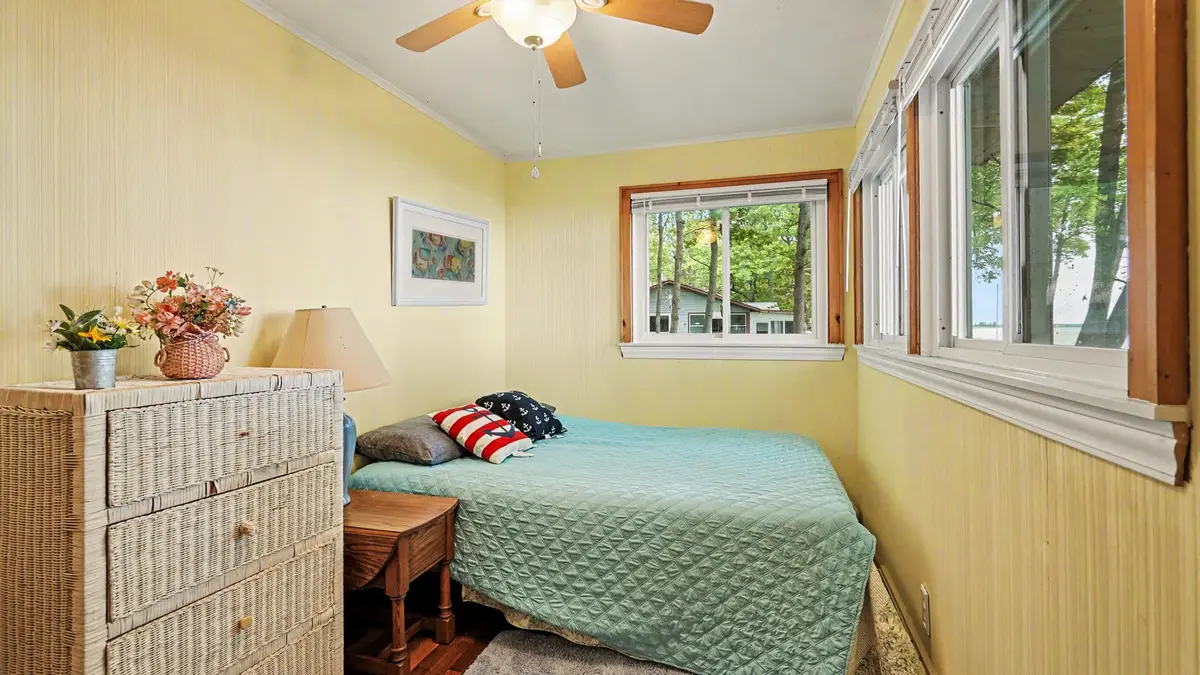 Cozy bedroom with yellow walls at Granny's Cabin