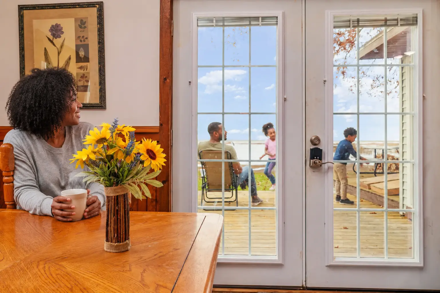 Cabin interior with sunflowers looking out at Lake Huron