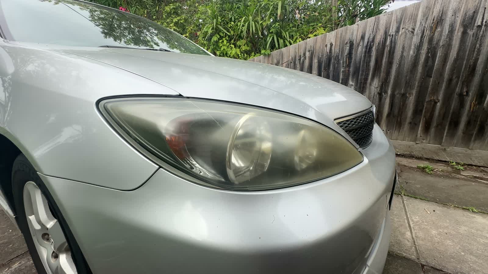 Yellowed headlight before restoration