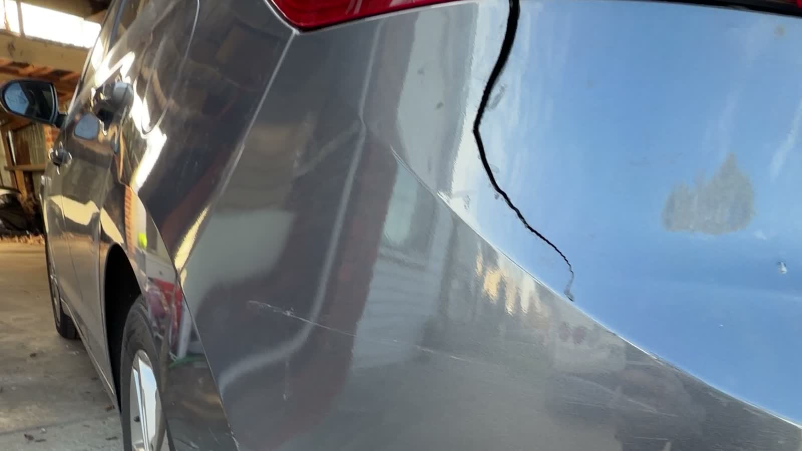 Cracked rear panel before repair