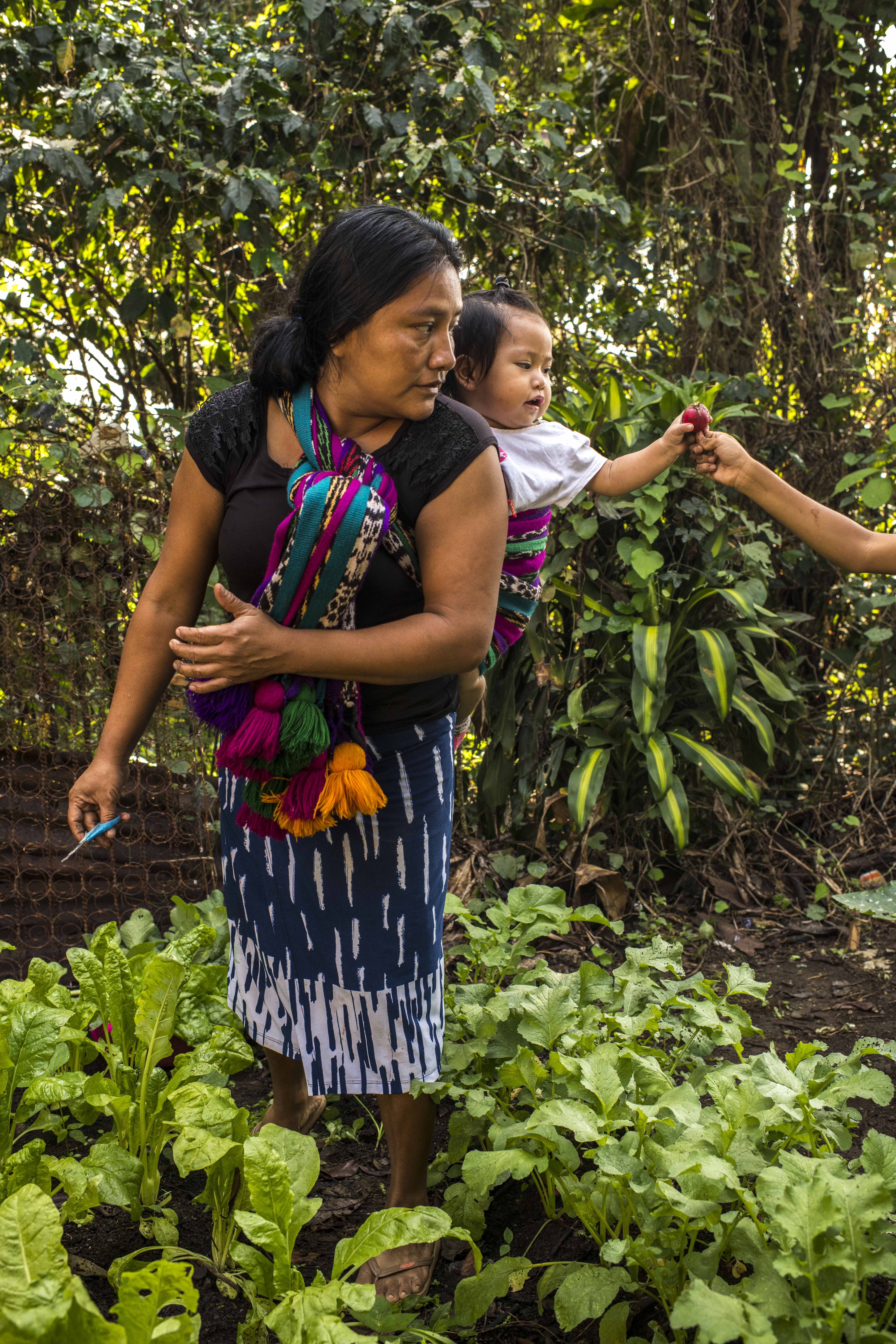 Mother with baby in garden