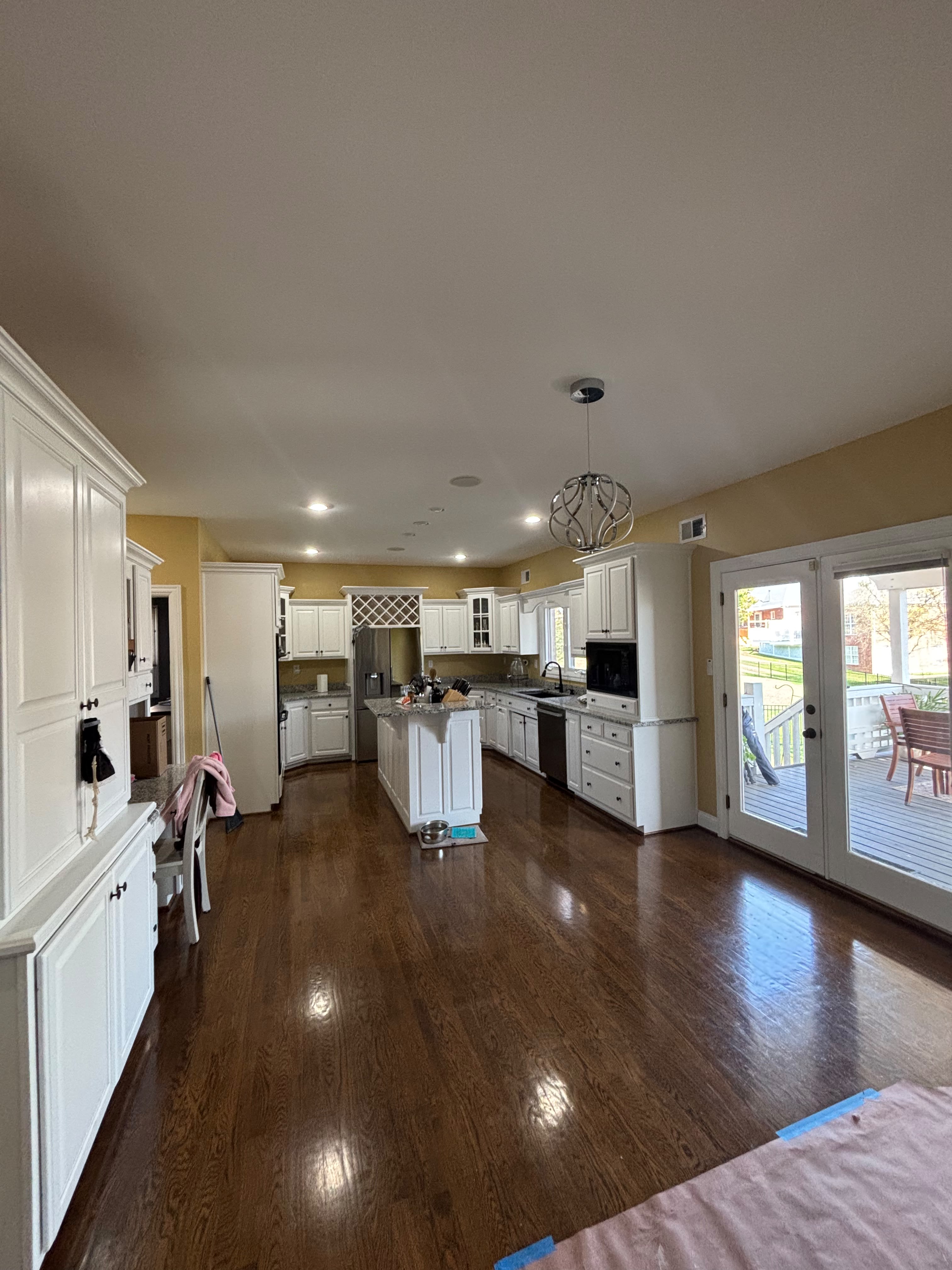 Finished white spray painted kitchen cabinets in a Louisville KY home by ECH Professional Painting
