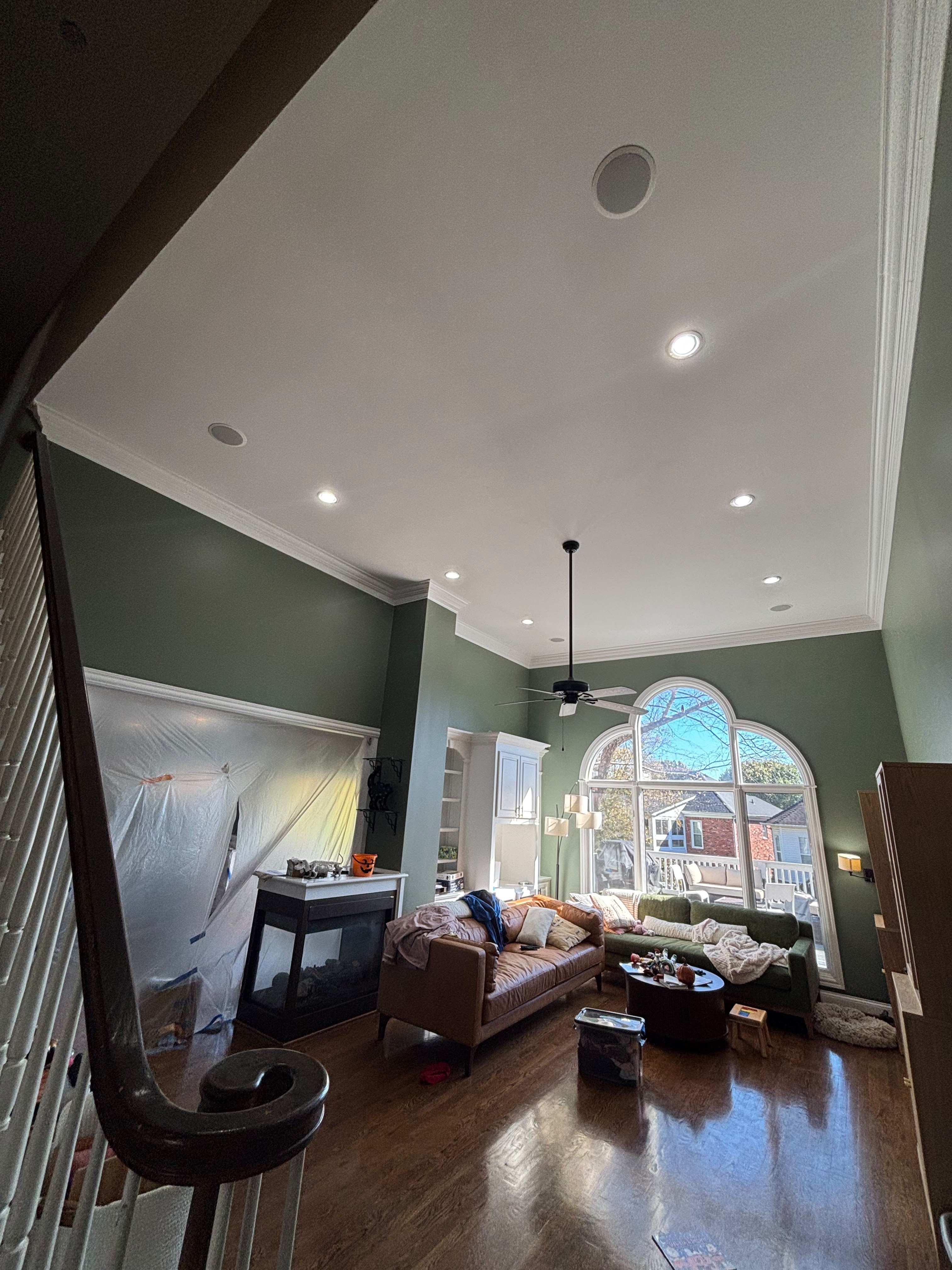 Room masked for painting with drop cloths in a Louisville KY home by ECH Professional Painting