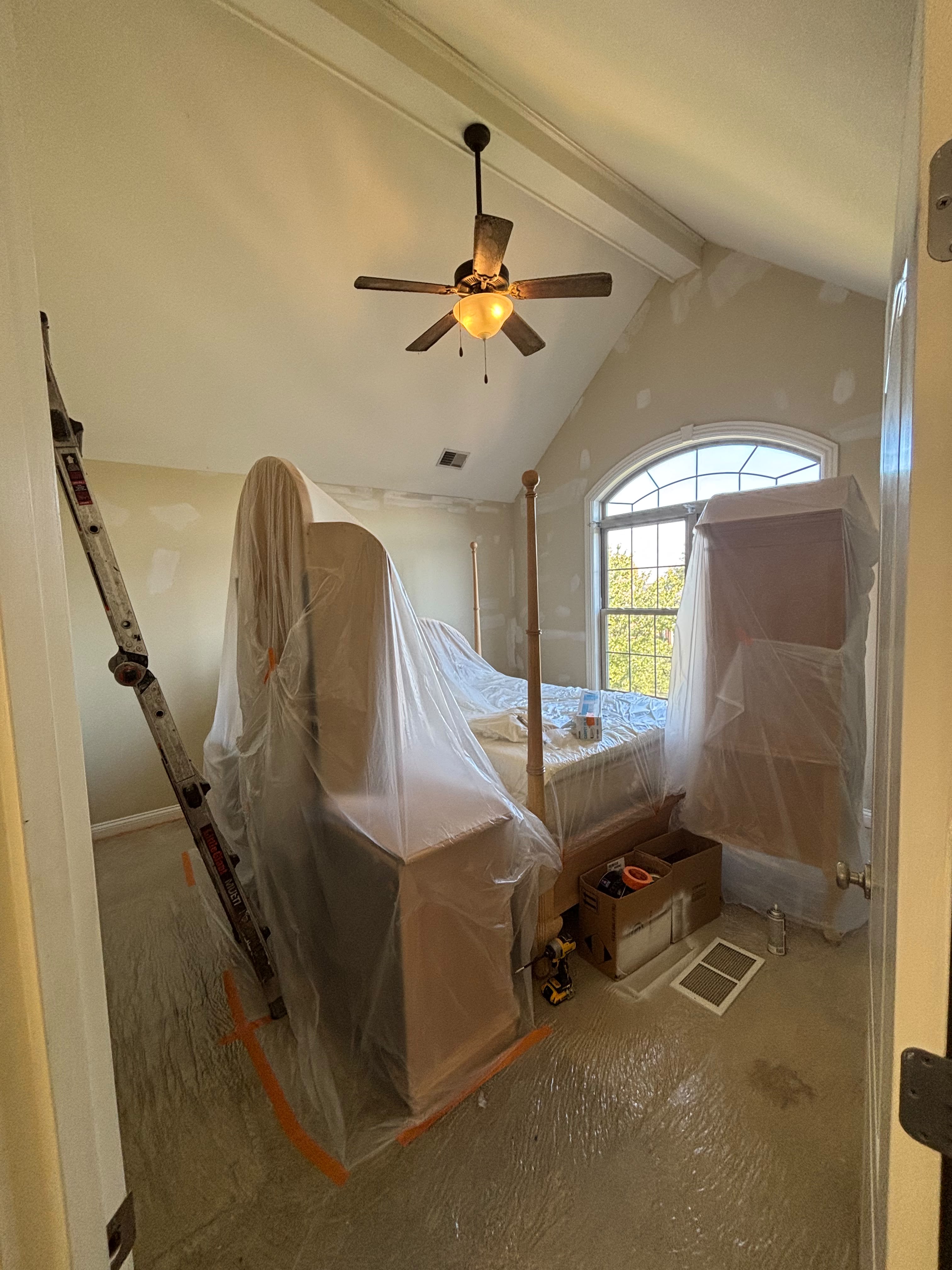 Room masked with plastic for interior painting in a Louisville KY home by ECH Professional Painting