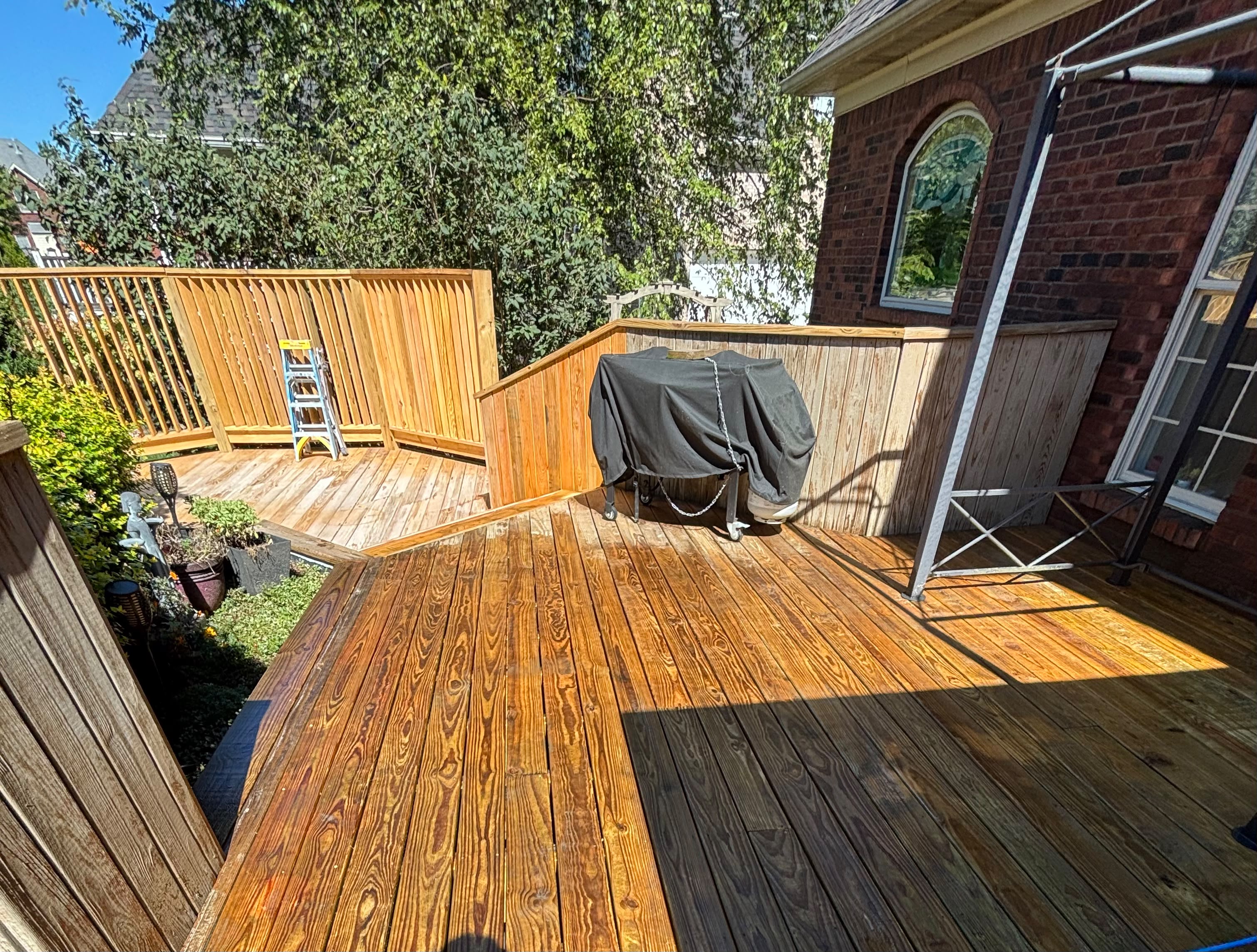 Deck and fence staining in progress in Louisville KY by ECH Professional Painting