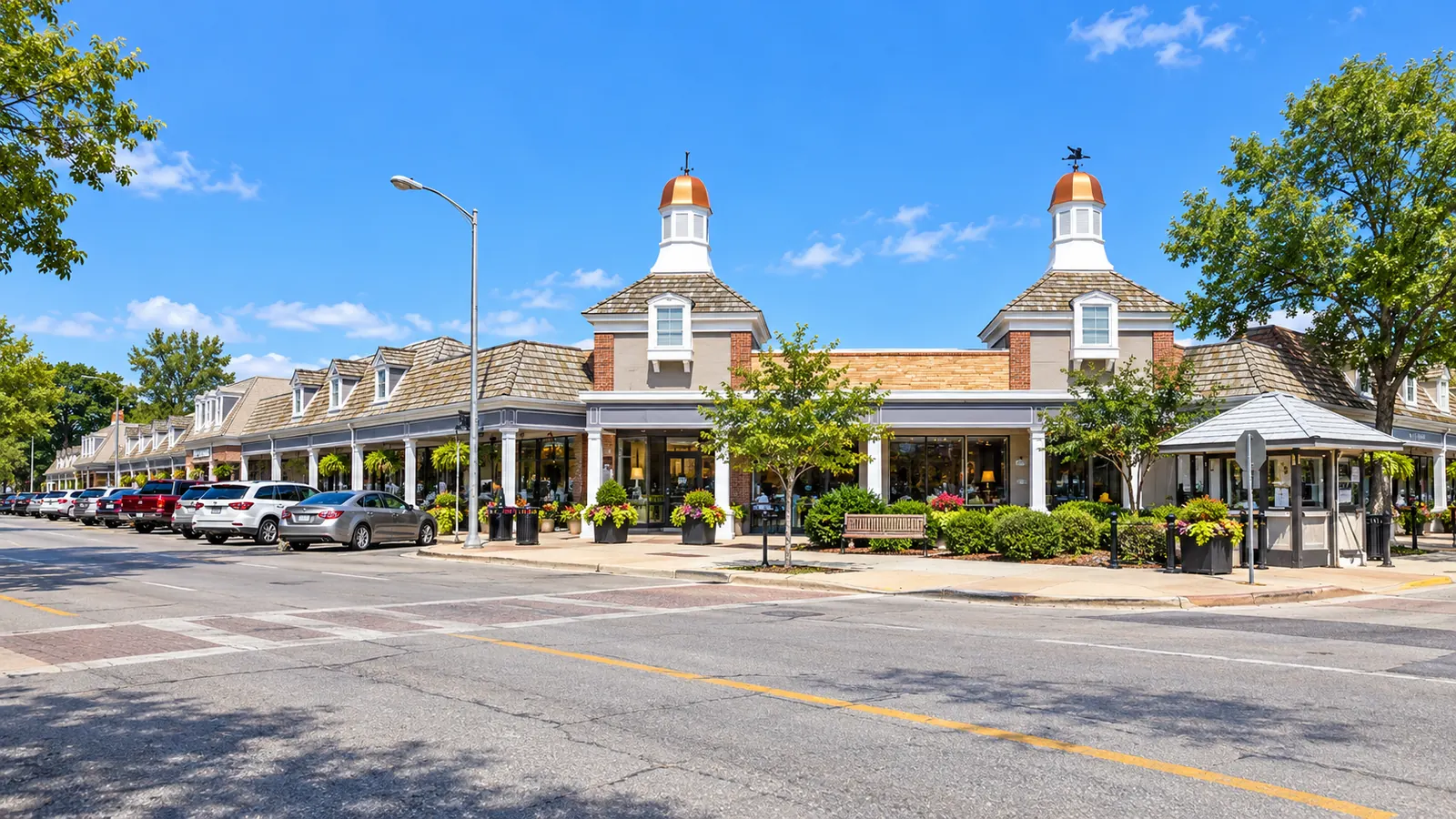 Illustration of the Shops of Prairie Village shopping district in Prairie Village, Kansas, with distinctive cupolas and storefronts.