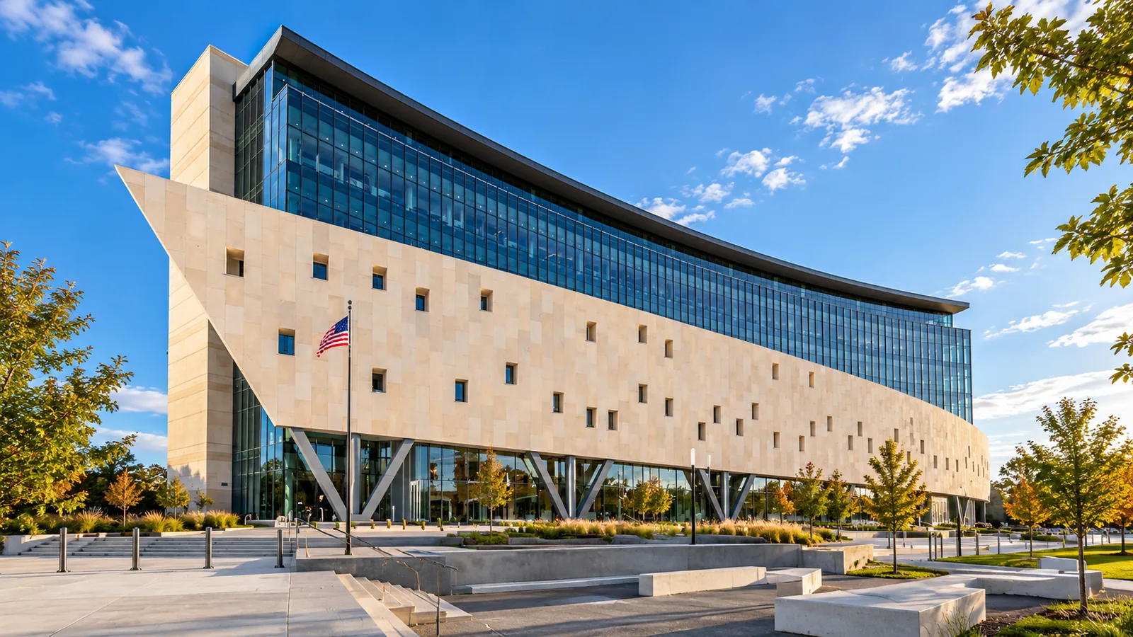 Illustration of the Johnson County Courthouse in Olathe, Kansas, with its curved limestone facade and glass upper stories.