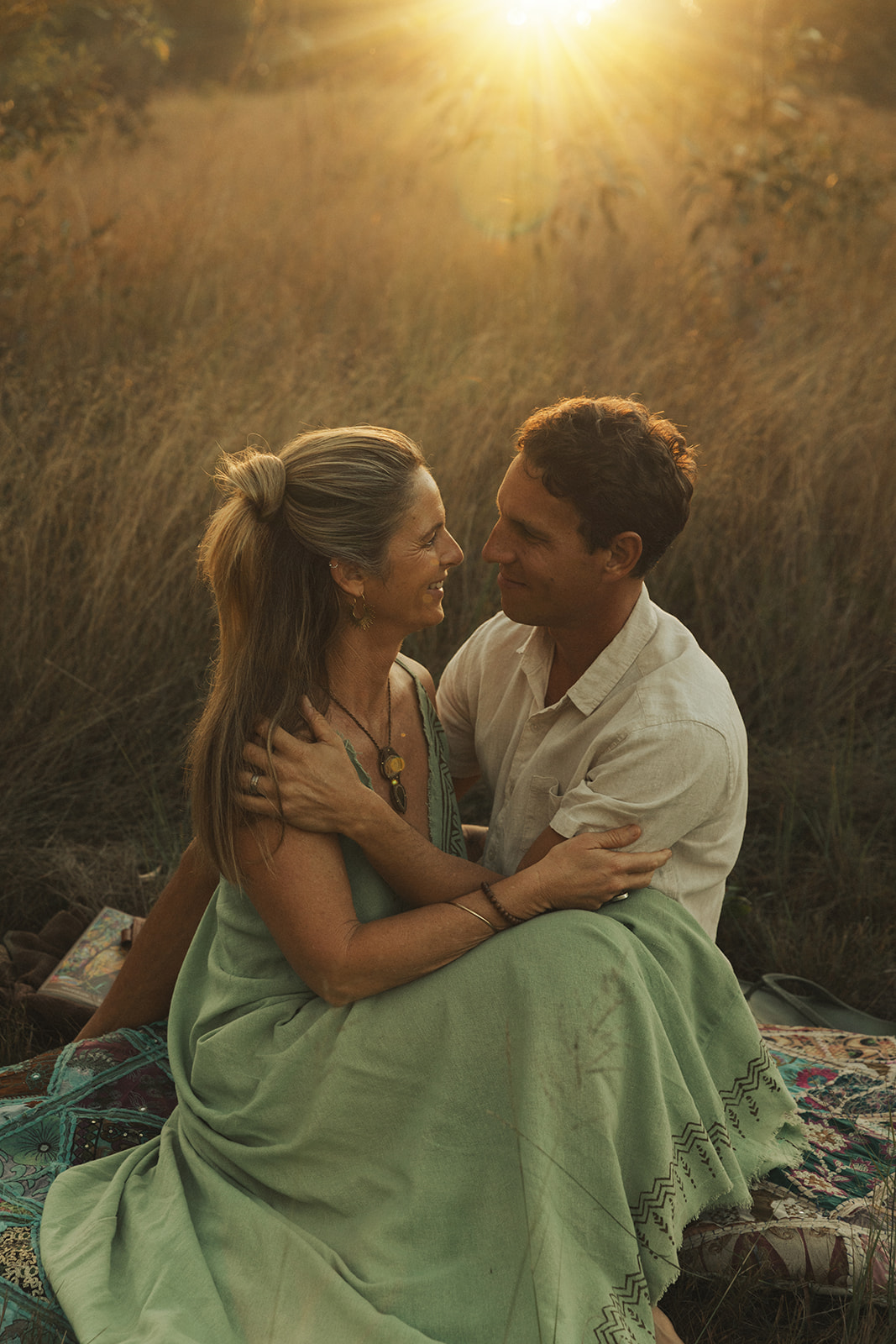 Michael and Amy sitting together in the grass