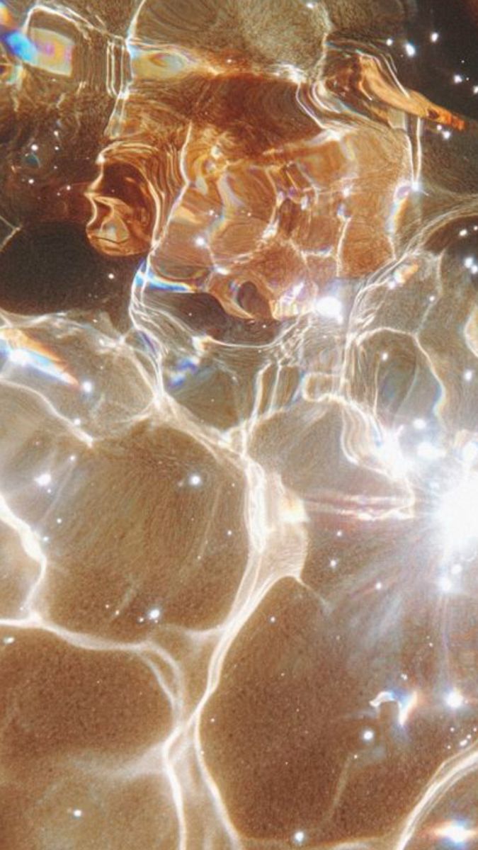 Golden sunlight shimmering through water